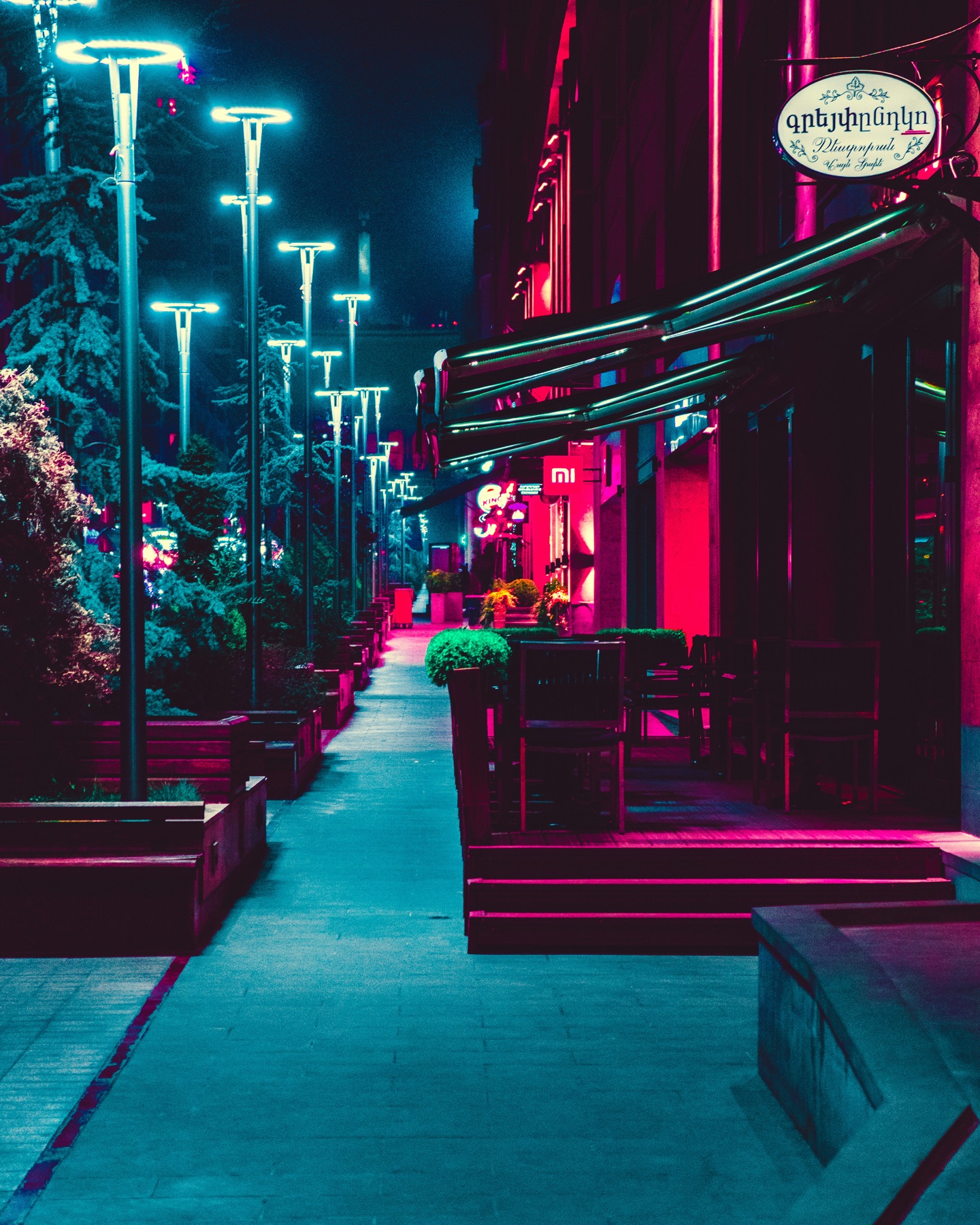 Restaurants and street lights glowing after dark in central Yerevan